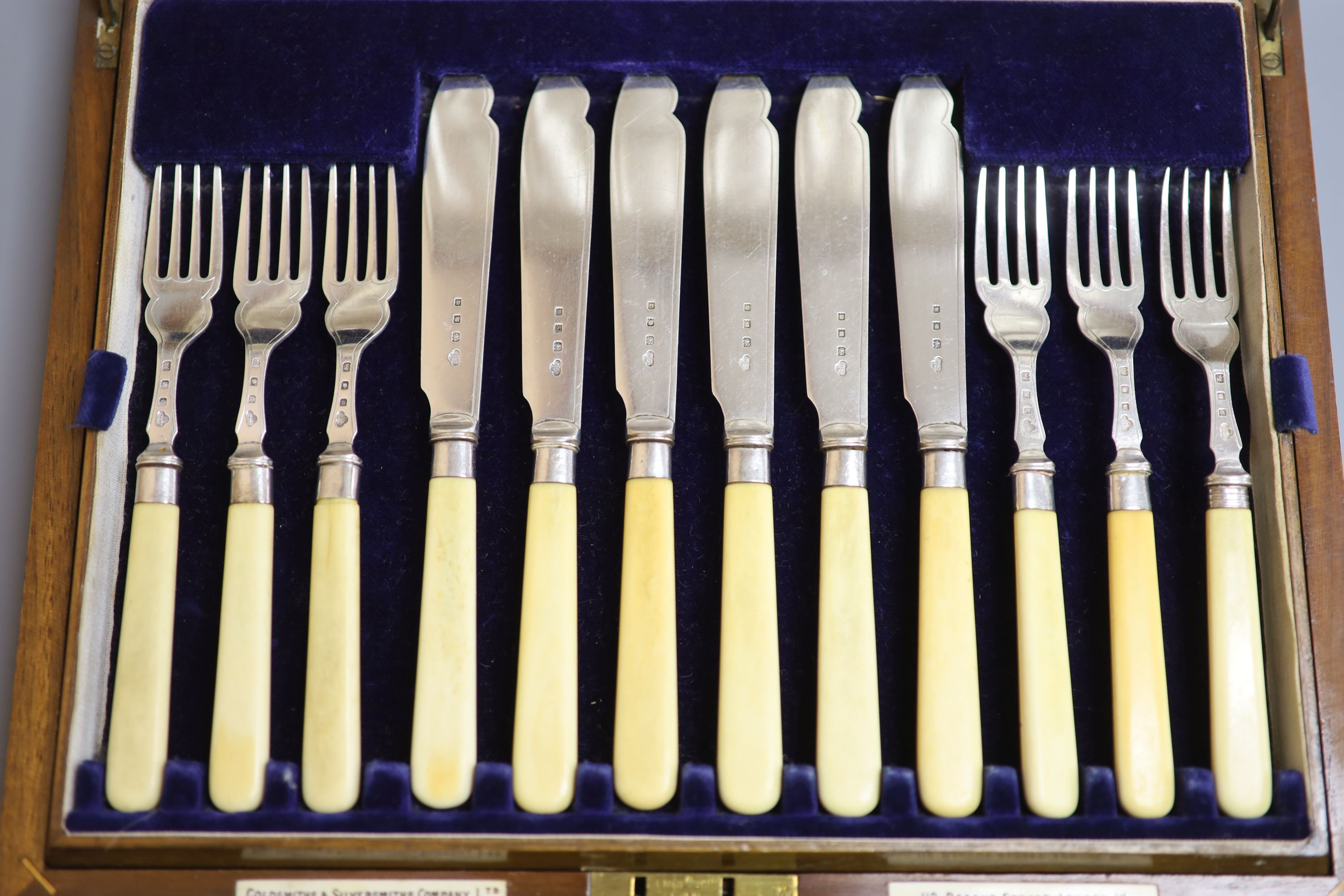 A cased set of twelve pairs of George V ivory handled silver fish eaters, Goldsmiths & Silversmiths Co Ltd, London, 1933.